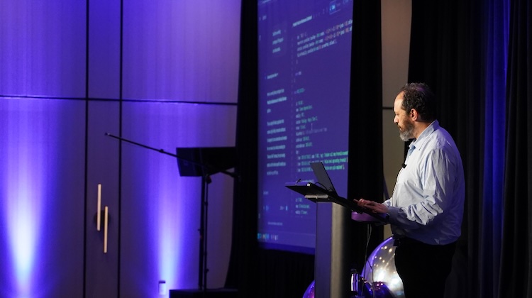 An image of Ethan Mollick speaking at the 2025 THMA Summit